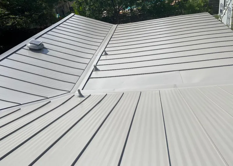 Solar attic fan installed on a metal roof for Roof Ventilation in Mundelein